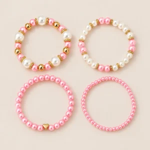 Set rosa de cuatro pulseras de imitación perla