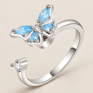 Anillo mariposa giratoria plateado con piedras azules